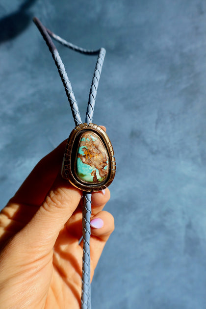 Royston Turquoise Bolo in Gold Alchemia on Blue Lether